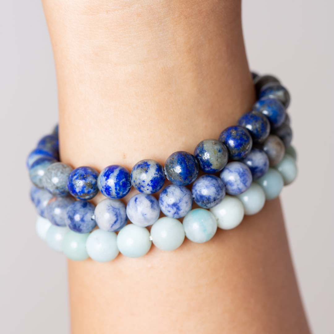 Womens wrist with Ambarya lapis lazuli, sodalite and amazonite mala beads