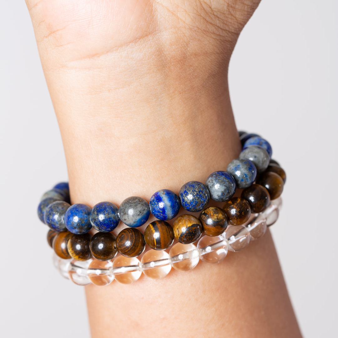 women's wrist with Ambarya lapis lazuli, tiger's eye and clear quartz mala beads
