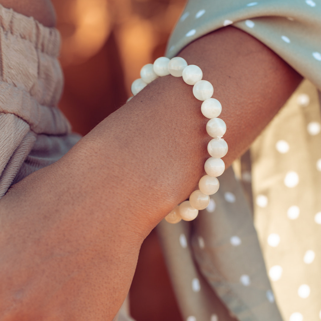 Close up of woman's wrist with Ambarya New Beginnings - Moonstone Mala Bead bracelet