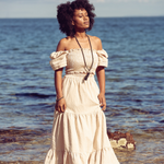 Woman standing at the beach with eyes closed wearing Ambarya  Willpower - Pyrite Mala Bead Set