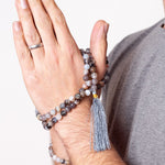 Man with Acceptance - Botswana Agate crystal Mala Bead Necklace wrapped around his hand