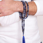 Man wearing Ambarya Insight - Sodalite Mala Bead Necklace wrapped around his wris