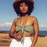 Woman looking at the camera with beach in the background she is wearing Ambarya Acceptance - Botswana Agate Mala Bead Set