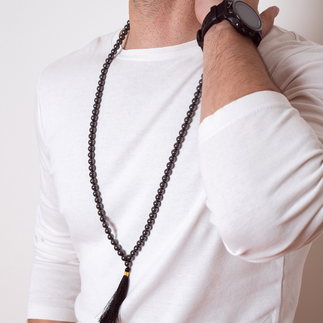 Man wearing Ambarya Strength - Hematite Mala Bead Necklace