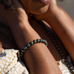 Close up on woman wearing Ambarya Willpower - Pyrite Mala Bead bracelet